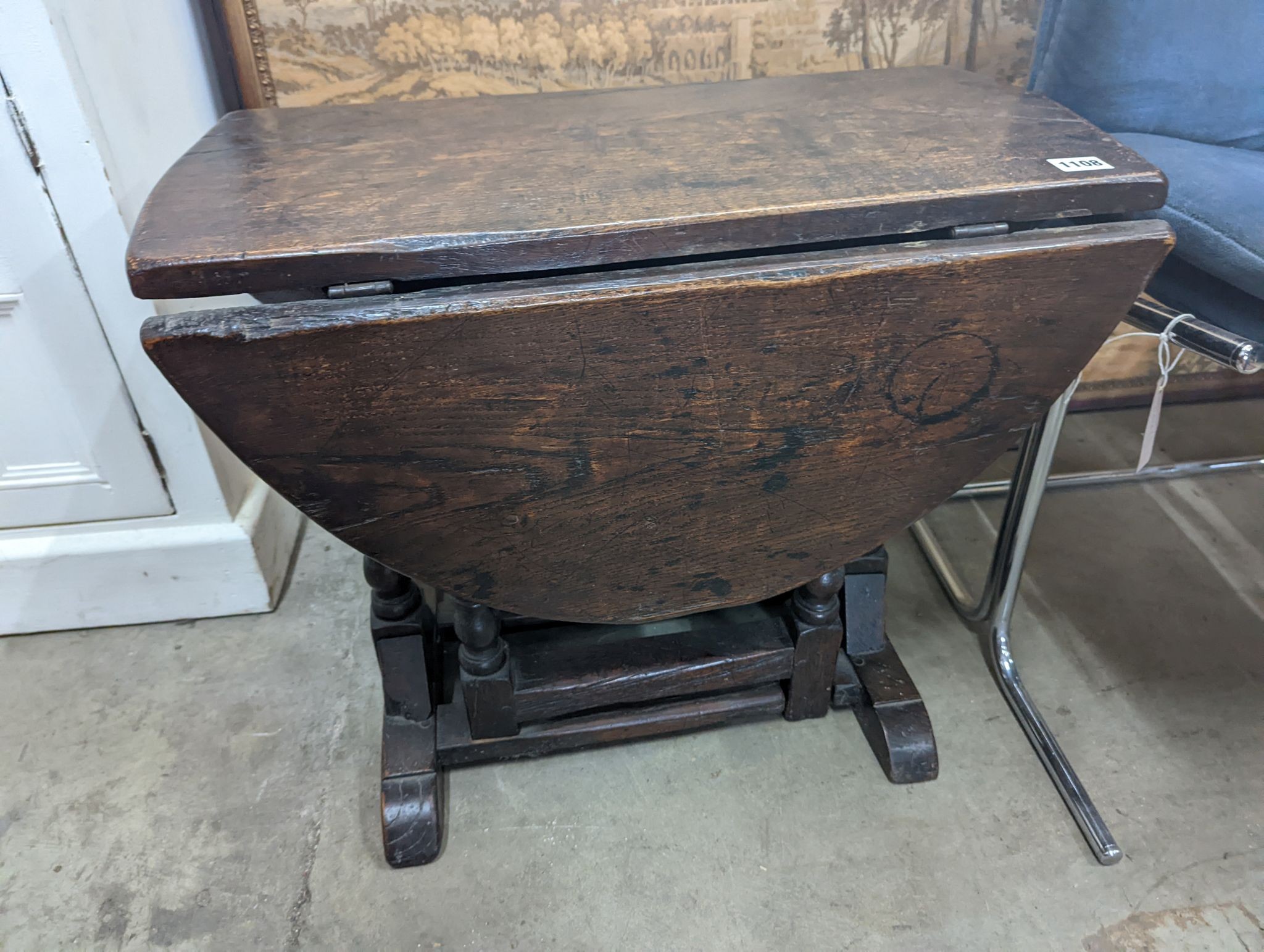 A 17th century style oak drop flap occasional table, width 62cm, depth 34cm, height 53cm